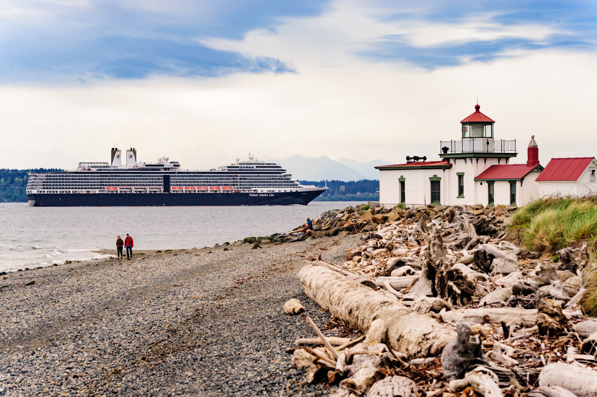 Holland America Line’s Eurodam sailing past the lighthouse at Discovery Park in Seattle